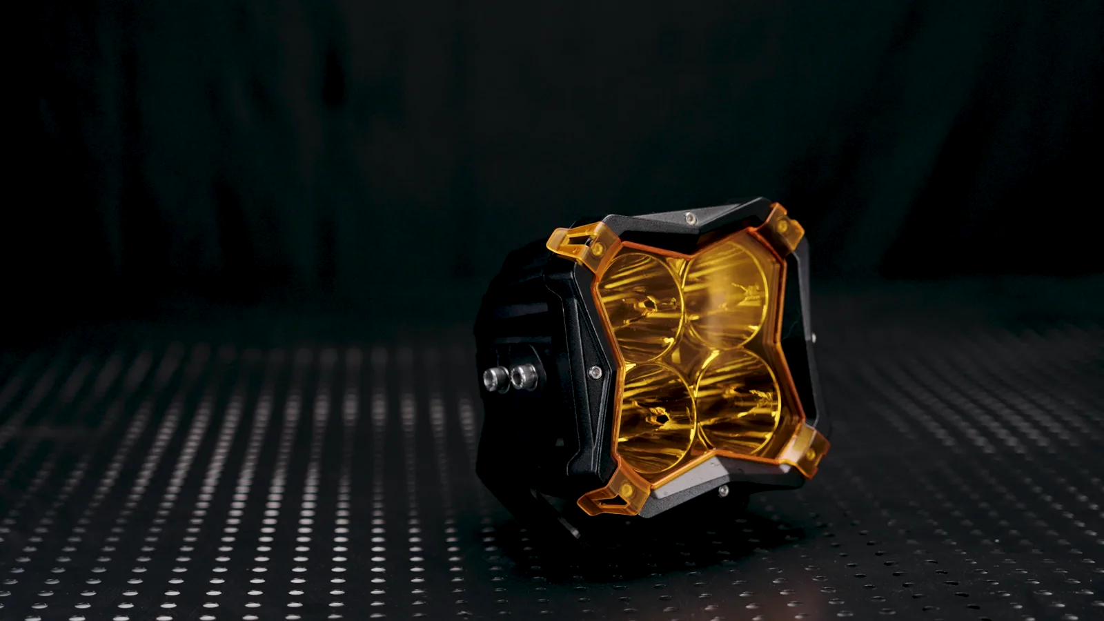 DXZ LED light pod illuminated on a dark studio set during a color-temperature capture