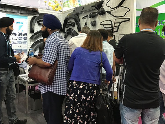 Visitors exploring SUNZ pickup accessories at an exhibition booth